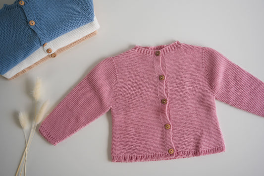 Embroidered knitted blanket with pompom